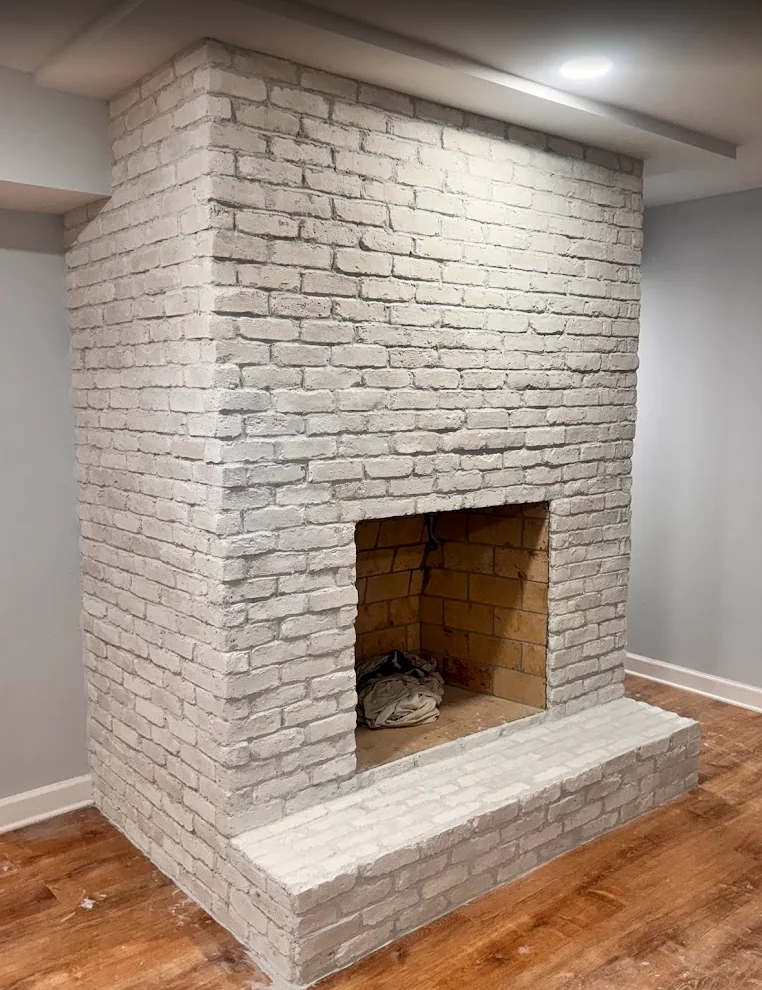 White-painted brick fireplace and hearth