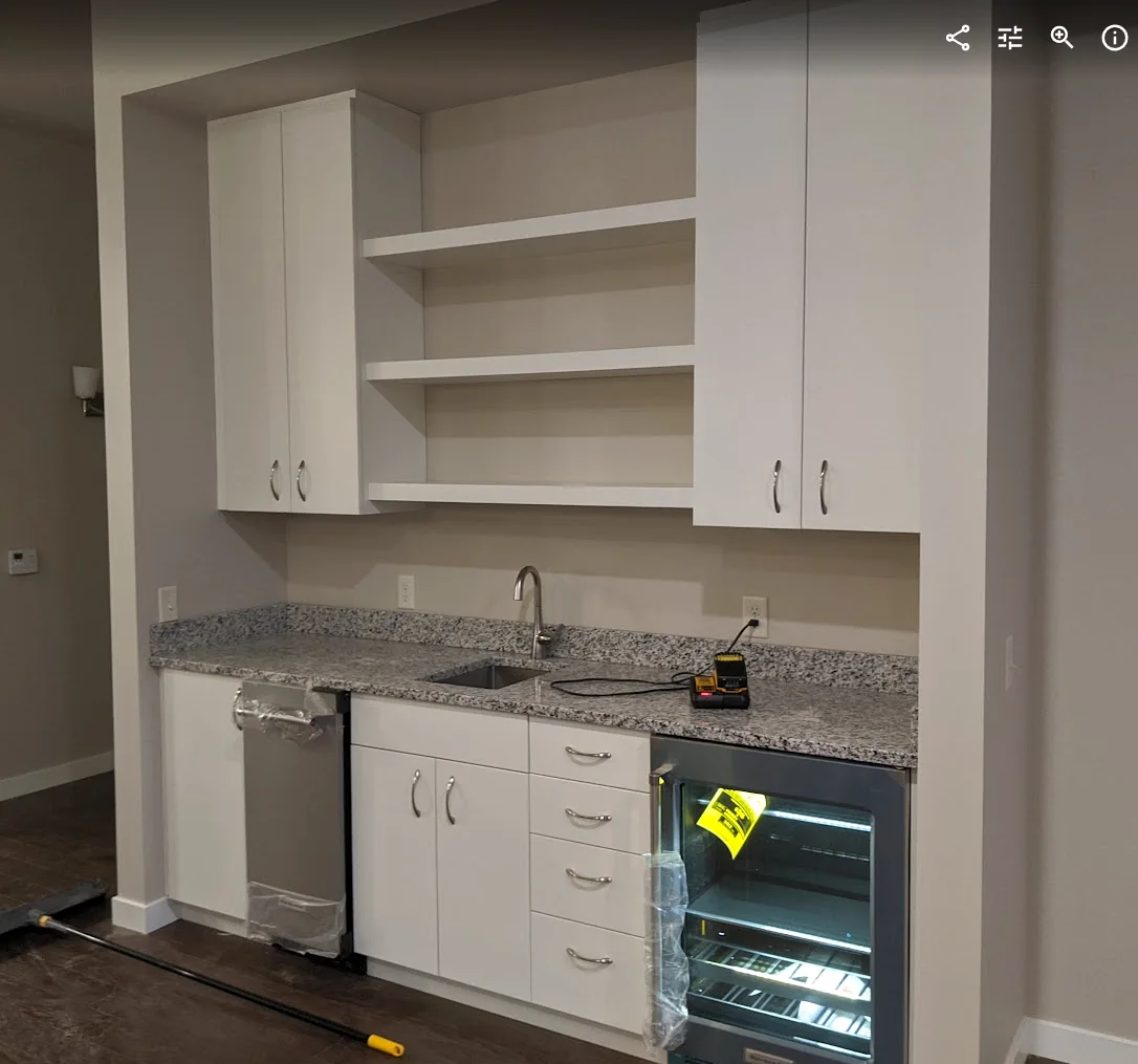 White kitchenette cabinetry